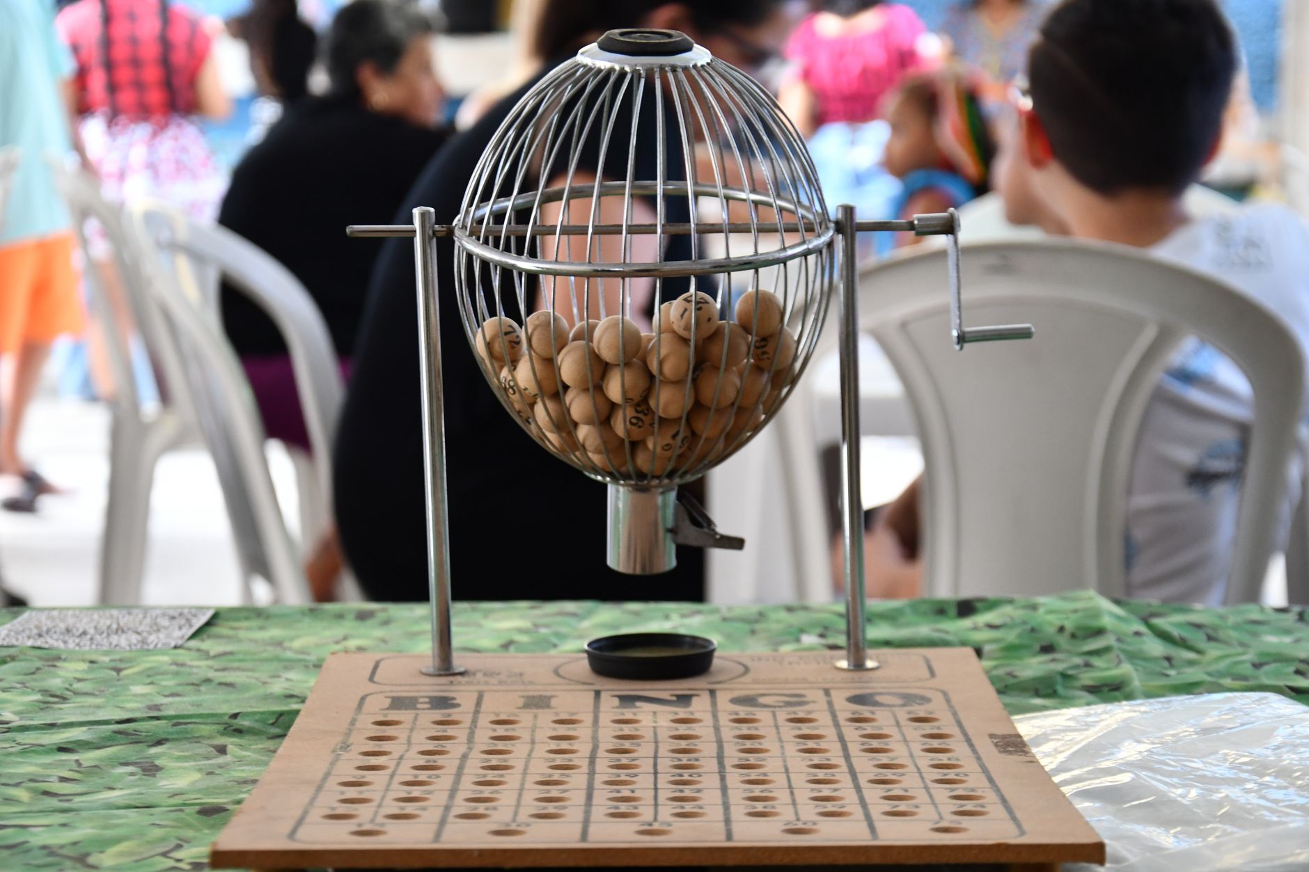 Numbered lottery balls in a drawing cage representing a lottery wheel